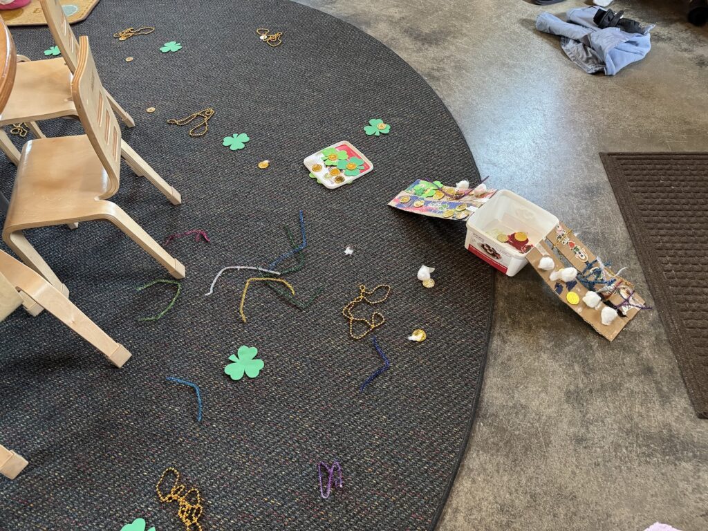 Leprechaun prank leaves preschool classroom floor in chaos with scattered Lucky Charms and green footprints during St. Patrick's Day celebration
