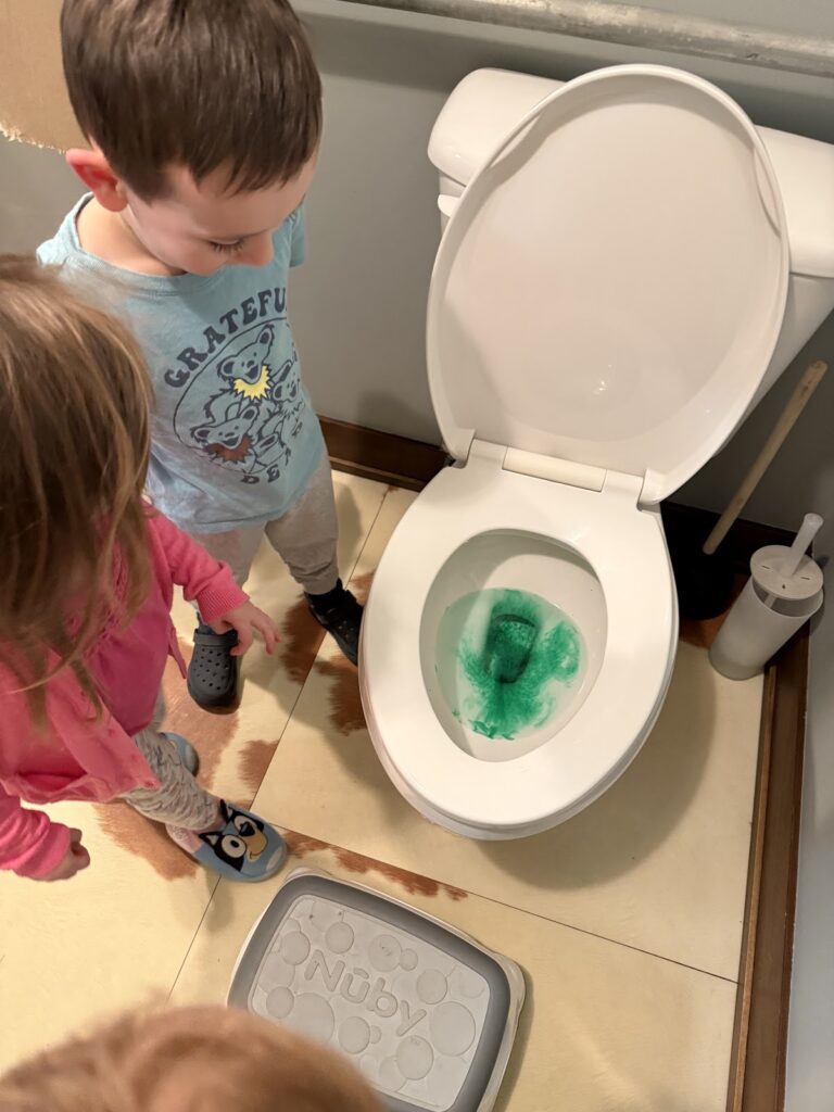 Mischievous leprechaun turns preschool toilet water green during St. Patrick's Day fun at Farm School
